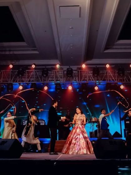 The grand finale of a couple's entry, complete with cold pyro and dancers, making for a spectacular photo opportunity.