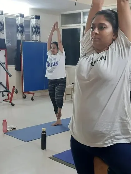 A duplicate of image 42, with another angle of the Tree Pose practice.