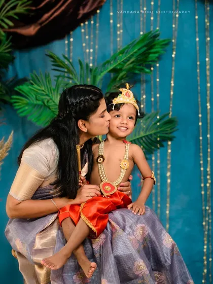Another beautiful moment from the Krishna-themed photoshoot, capturing the loving bond between mother and child. I ensure a variety of poses and expressions.