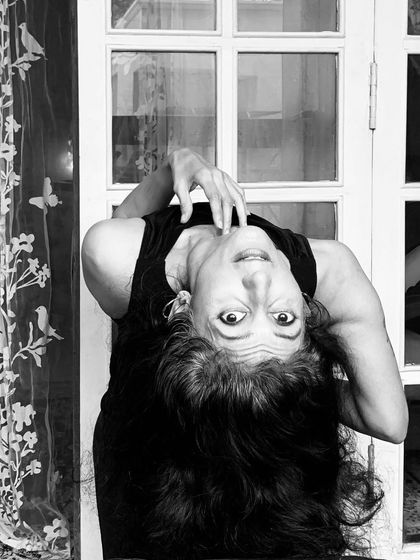 An upside-down world. A playful black and white portrait that challenges perspective.