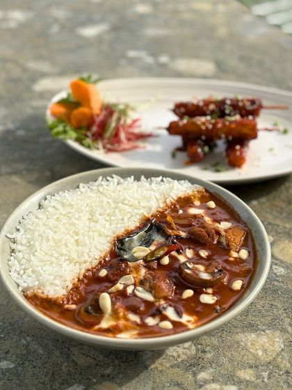 Our Massaman curry is a rich and aromatic dish, perfectly balanced with coconut milk, spices, and peanuts. It's a taste of Thailand right here in our garden.