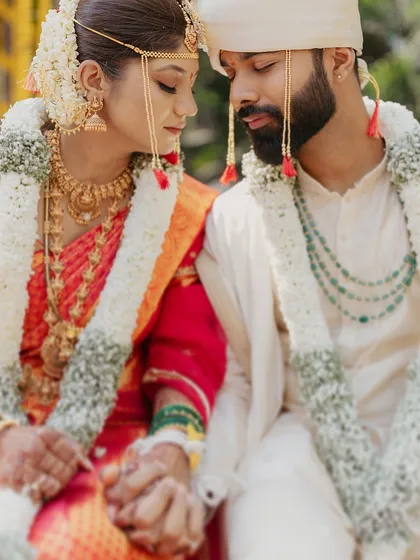 A quiet moment of connection between the bride and groom during their Marathi wedding ceremony.