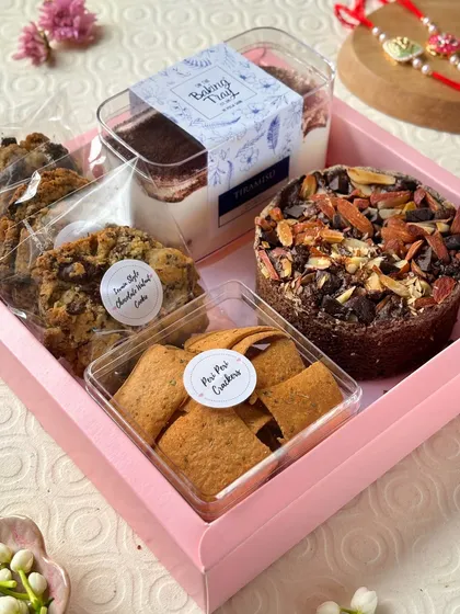 Here’s a closer look at one of my popular Rakhi hampers. It’s the perfect mix of sweet and savory, featuring a rich almond chocolate cake, Levain style cookies, a classic Tiramisu tub, and some zesty Peri-Peri crackers for balance.