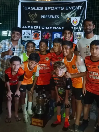 Our U13 squad celebrating their championship victory at the Andheri Champions League.
