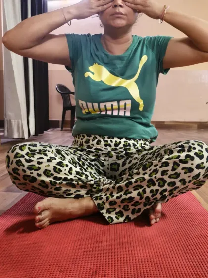 Another student practicing Bhramari, demonstrating the simple yet profound power of yogic breathing to restore balance to the mind and body.