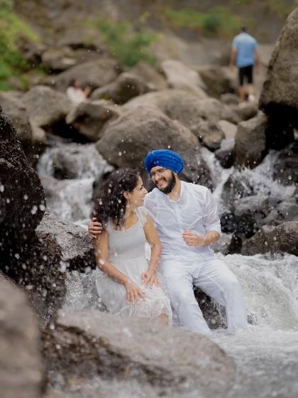 A playful and joyous moment of the couple in the water, showing that pre-wedding shoots can be fun and adventurous.