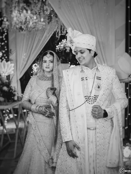 A formal black and white portrait of the couple, exuding elegance and grace. This style is perfect for creating classic wedding heirlooms.