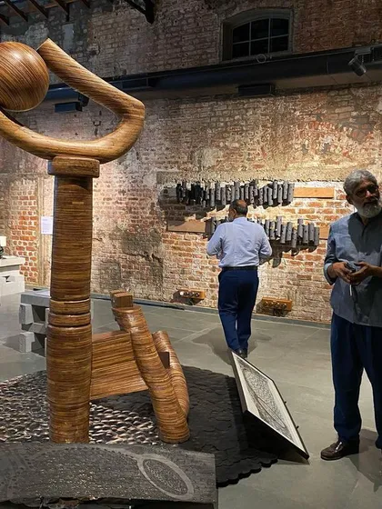 Artist Walter D’Souza discussing his sculpture at the 'Intersection' exhibit we curated. The piece, made from waste plywood collected over years, was a highlight of the show.