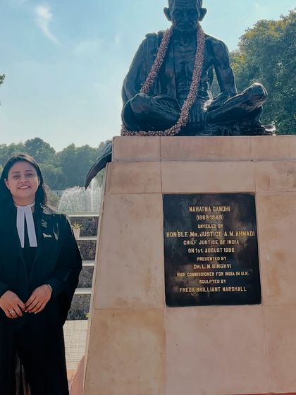 At the Supreme Court, standing before the statue of Mahatma Gandhi. His teachings on truth and justice are a constant source of inspiration in my legal practice.