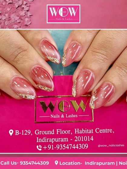 A beautiful pink cat-eye polish with a touch of gold glitter at the tips. This design combines two popular trends for a look that is both magical and glamorous.