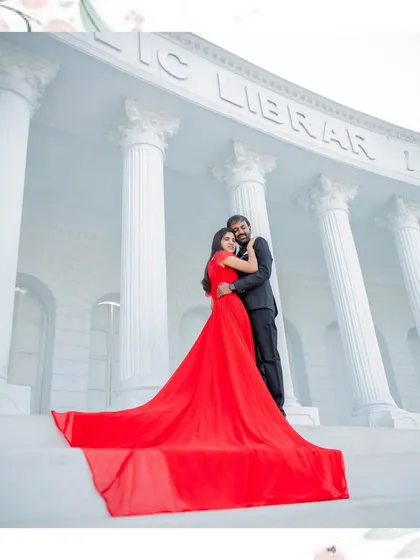 A beautiful full-length portrait of the couple embracing on the steps, framed with a delicate floral design.