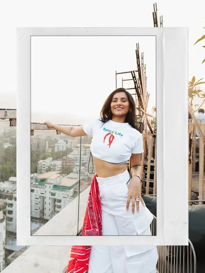 A polaroid-style shot from the rooftop, framing the city view behind me. This captures the urban, stylish vibe of my sundowner parties.