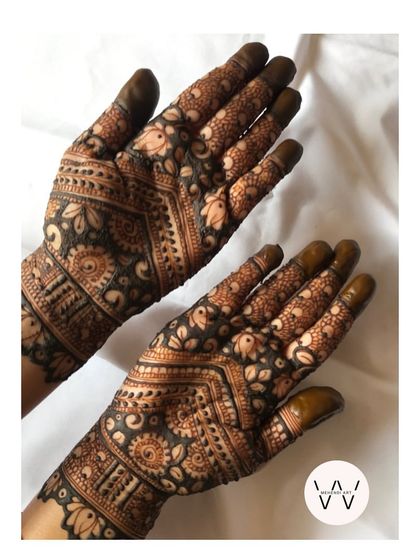 A beautiful, dense design featuring a mix of floral and traditional patterns.