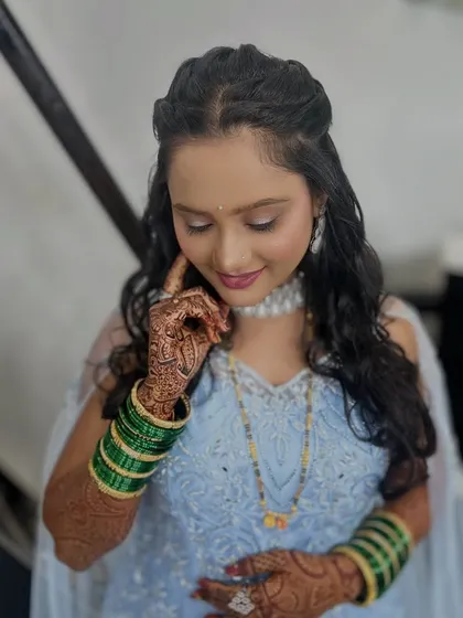 A close-up of the soft makeup and hairstyle.