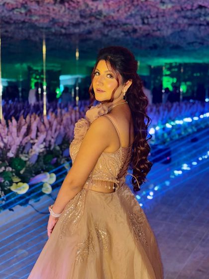 A candid shot of the client in her gown, showing how comfortable and confident she feels. My goal is to make you feel as good as you look.