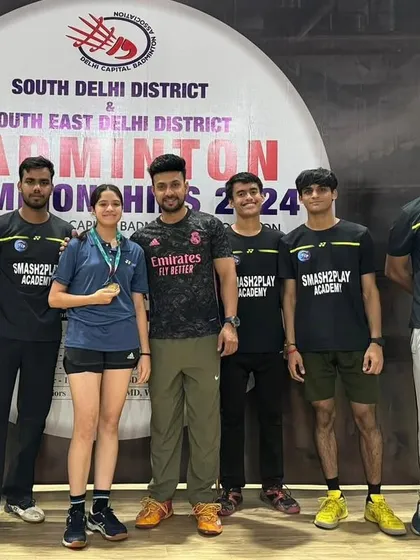 My coaching team and I with some of our medal-winning students. I believe in celebrating every achievement, big or small, to keep my players motivated and inspired.