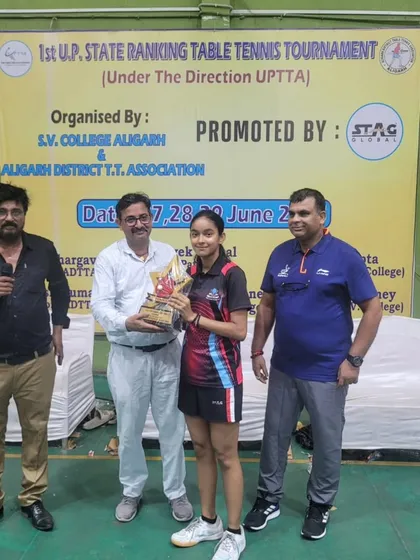 Anokhi Keshari receives her trophy for winning the U-15 Girls category at the Aligarh state tournament.