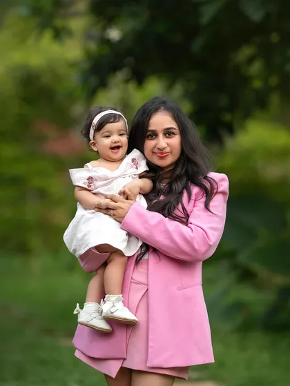 So much love in one photo! The joy on this baby's face as her mom holds her is just infectious.