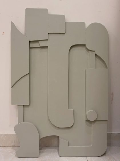 What do you see? This is an abstract sculptural piece on board, finished in a single, calming sage green. The layered shapes can be interpreted in many ways, making it a great conversation starter.