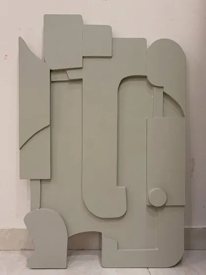 What do you see? This is an abstract sculptural piece on board, finished in a single, calming sage green. The layered shapes can be interpreted in many ways, making it a great conversation starter.