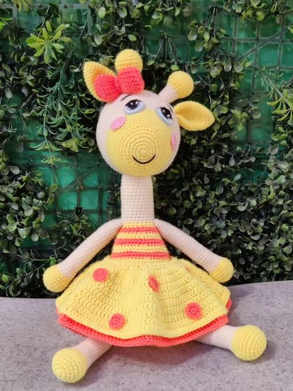 The full view of the custom giraffe doll, ready to be gifted.