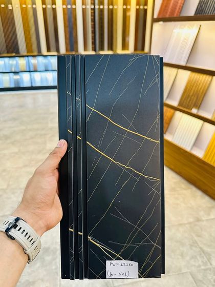 This black fluted panel with gold marble-like streaks offers a very luxurious and bold look, perfect for creating a statement wall.