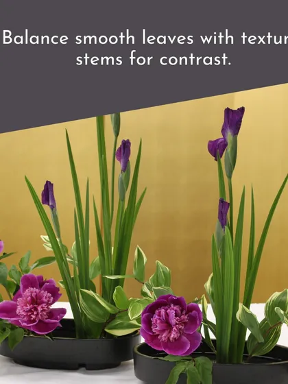 This Ikebana-style arrangement demonstrates how to balance smooth leaves with textured stems for contrast, creating a visually interesting and harmonious composition.