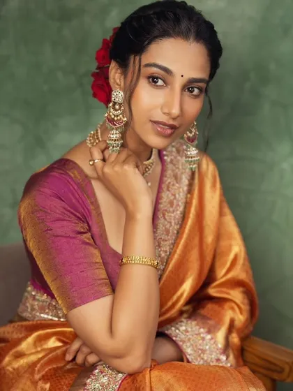 Another elegant portrait from the traditional silk saree shoot. The focus is on the model's graceful expression and the exquisite details of the jewelry and saree border.