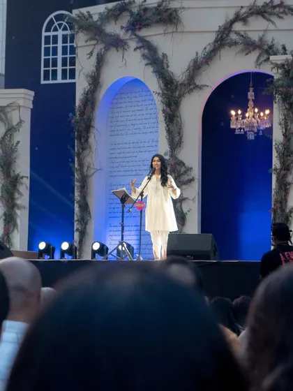 Another perspective of Nayab Midha on the grand stage. The makeup ensures her expressions are clear and her features are defined for everyone in the audience.