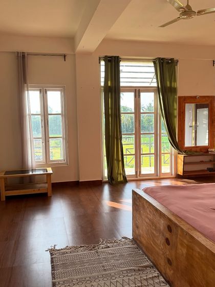 Another view of the beautiful, sunlit room at our pet-friendly stay near Nandi Hills.