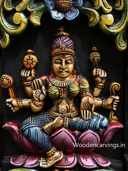 Detail of another goddess from the AshtaLakshmi panel. Each deity is painted with a unique color palette, distinguishing her form and attributes within the larger composition.