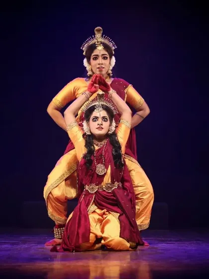 A strong, balanced pose from "Shrishti Stithi Laya". The symmetry and power in this formation reflect the cosmic balance that is a central theme of the production.