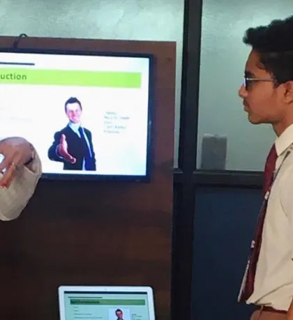 Coaching is a partnership. Whether it's a group workshop or a one-on-one session, my focus is on providing personalized guidance. Here, I'm working with a student on mastering the art of a confident self-introduction, a crucial skill for any career.