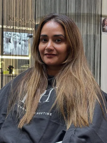 The 'before' shot for this beige blonde transformation. Her hair was previously a darker, grown-out color.