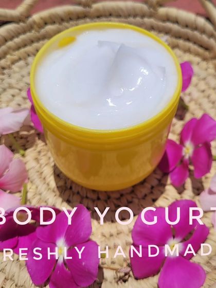 A scoop of my creamy white Body Yogurt, surrounded by fresh flowers. This moisturizer is lightweight but provides deep hydration, leaving your skin feeling soft and smooth.