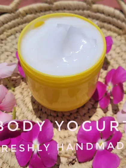 A scoop of my creamy white Body Yogurt, surrounded by fresh flowers. This moisturizer is lightweight but provides deep hydration, leaving your skin feeling soft and smooth.