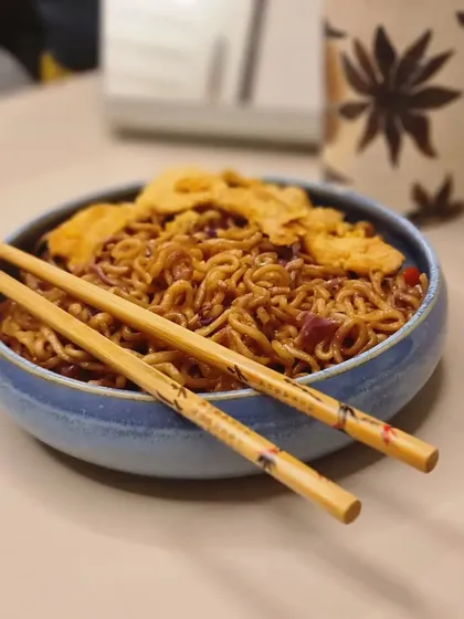 My handmade pasta bowls are not only functional but also a work of art. This blue bowl, shown here with noodles, makes any meal feel more special.
