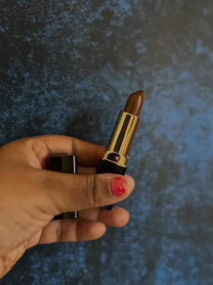 This is my handmade lipstick in a versatile brown shade. It's a perfect neutral color that complements many skin tones.