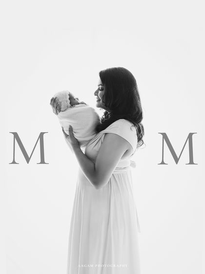 The same beautiful moment in classic black and white, emphasizing the emotional connection and timelessness of motherhood.