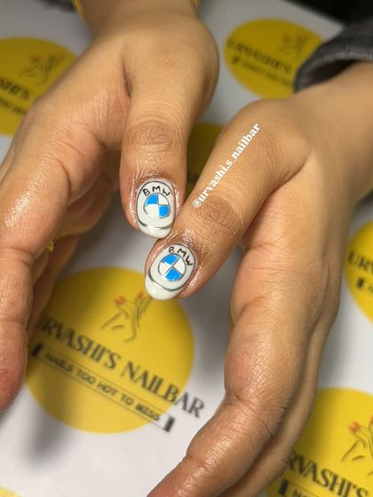 For the car enthusiast, this set was inspired by BMW. I hand-painted the logo, the iconic M-series stripes, and a checkered racing flag for a high-speed manicure.