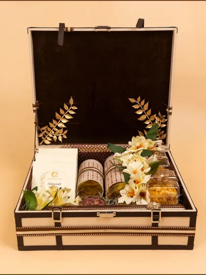 Our wedding trunk standing tall, showcasing its fine craftsmanship and elegant interior. The gold foil leaf details on the velvet lining add a touch of regal sophistication.