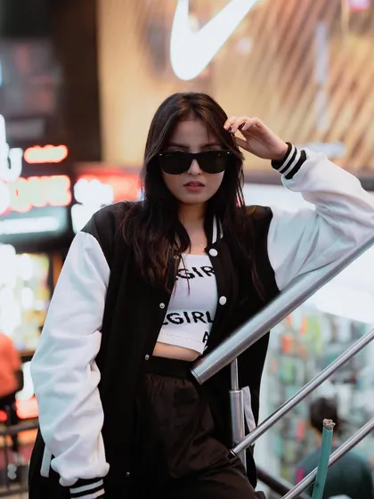 A duplicate of image 371, this night shoot uses city lights to create a cool, edgy street style portrait.