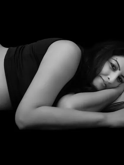 Sometimes, a simple black and white photograph speaks volumes. This classic, minimalist portrait focuses on the quiet connection between a mother and her unborn baby, creating a timeless piece of art that you will cherish forever.