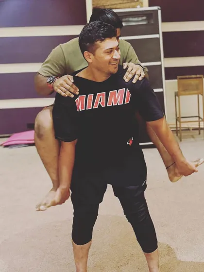 A fun and playful moment in an Acro Yoga session. It's not just about the poses, but also about the connection and laughter.