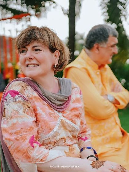 A guest enjoying the Haldi ceremony. I make sure to capture the happy faces of friends and family who are there to celebrate with you.