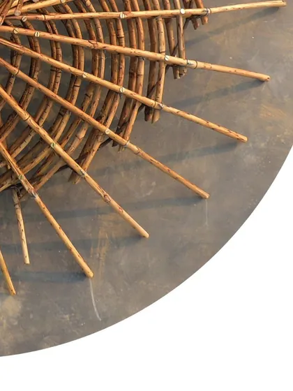 This detail shot of the maquette highlights the craftsmanship involved in bamboo construction, a skill that combines natural material knowledge with precise engineering.