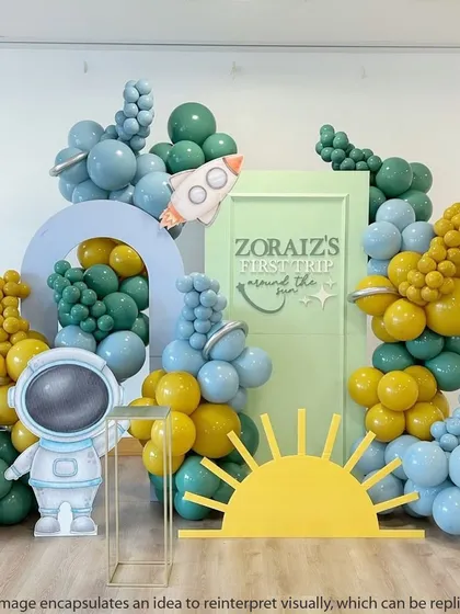 A modern and artistic space theme with a unique color palette of mustard yellow and shades of green and blue. The astronaut and sun cutouts add a playful touch.