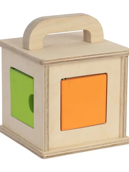 A wooden puzzle box toy, shot from the front on a white background.