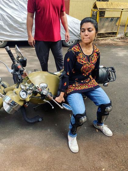 A student practices lifting the bike, a key skill for independence. We ensure every rider is prepared for real-world situations.