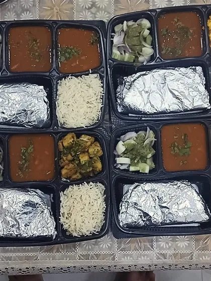 A simple and satisfying meal for four people. These thalis feature a paneer dish, a homely dal, rice, and rotis. Perfect for a small family lunch or dinner.